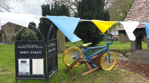 65 80 Wetwang church 7 sign and bike